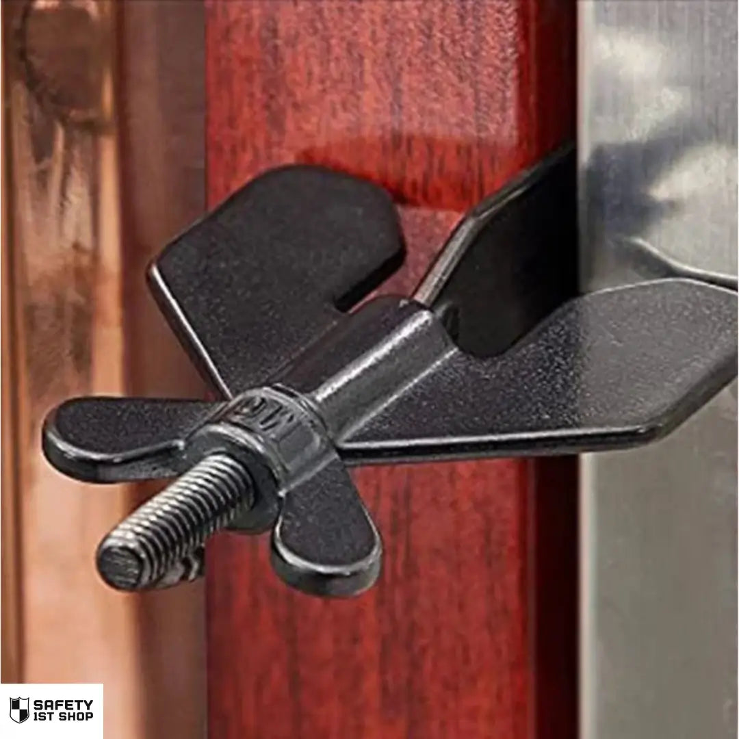Black door security device installed in a door to prevent unauthorized entry