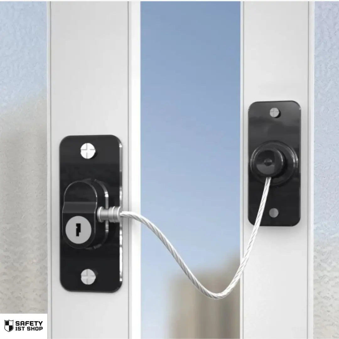 Black window safety lock with key mechanism, mounted to restrict full opening and prevent unauthorized acces
