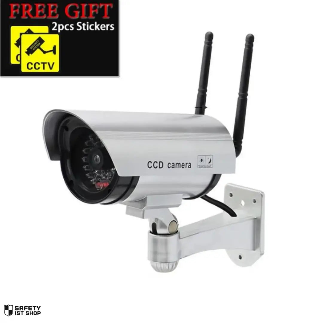 Realistic white dummy surveillance camera with wall mount, presented on white background with free security stickers included