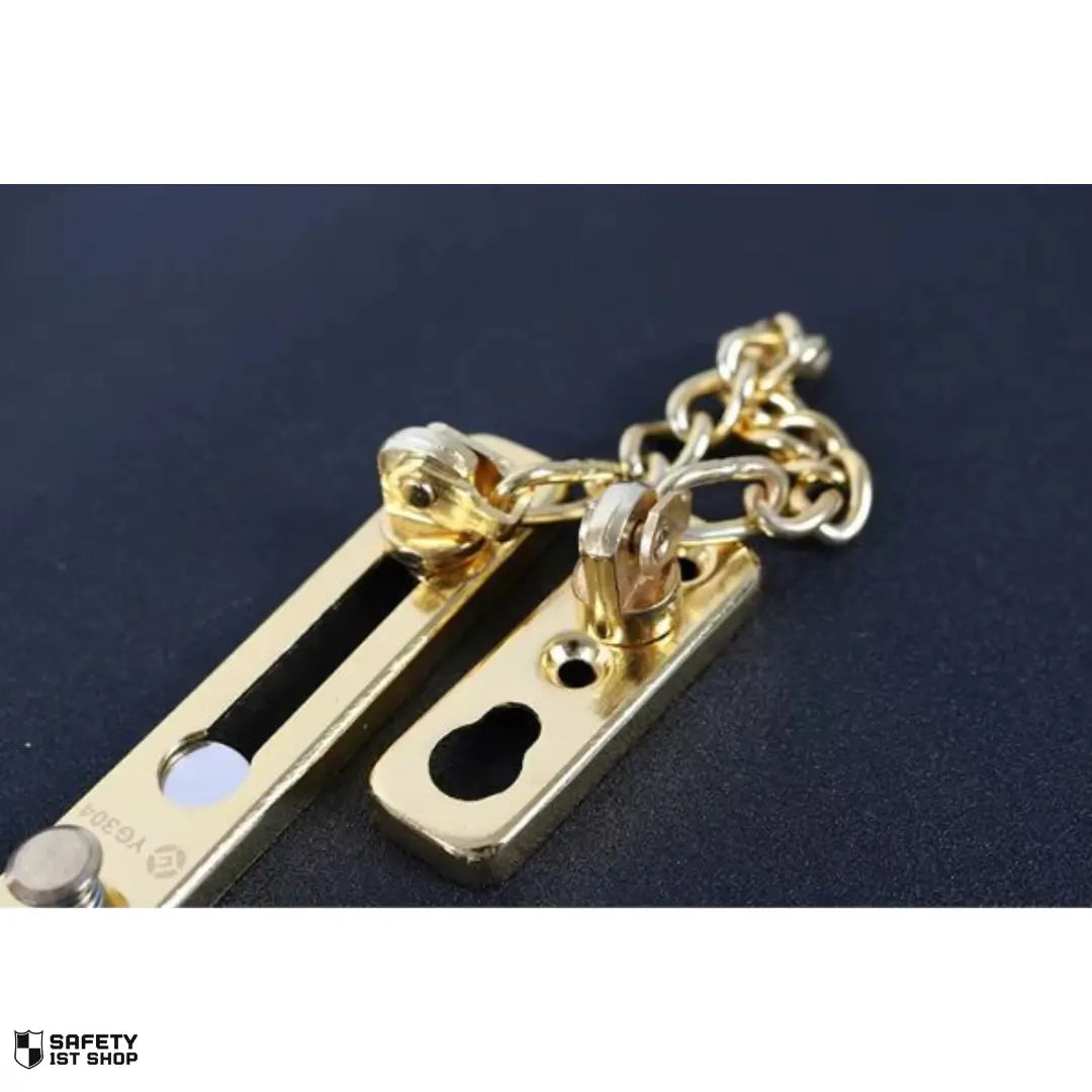 Luxurious gold stainless stell door chain lock displayed on a dark background for premium home protection