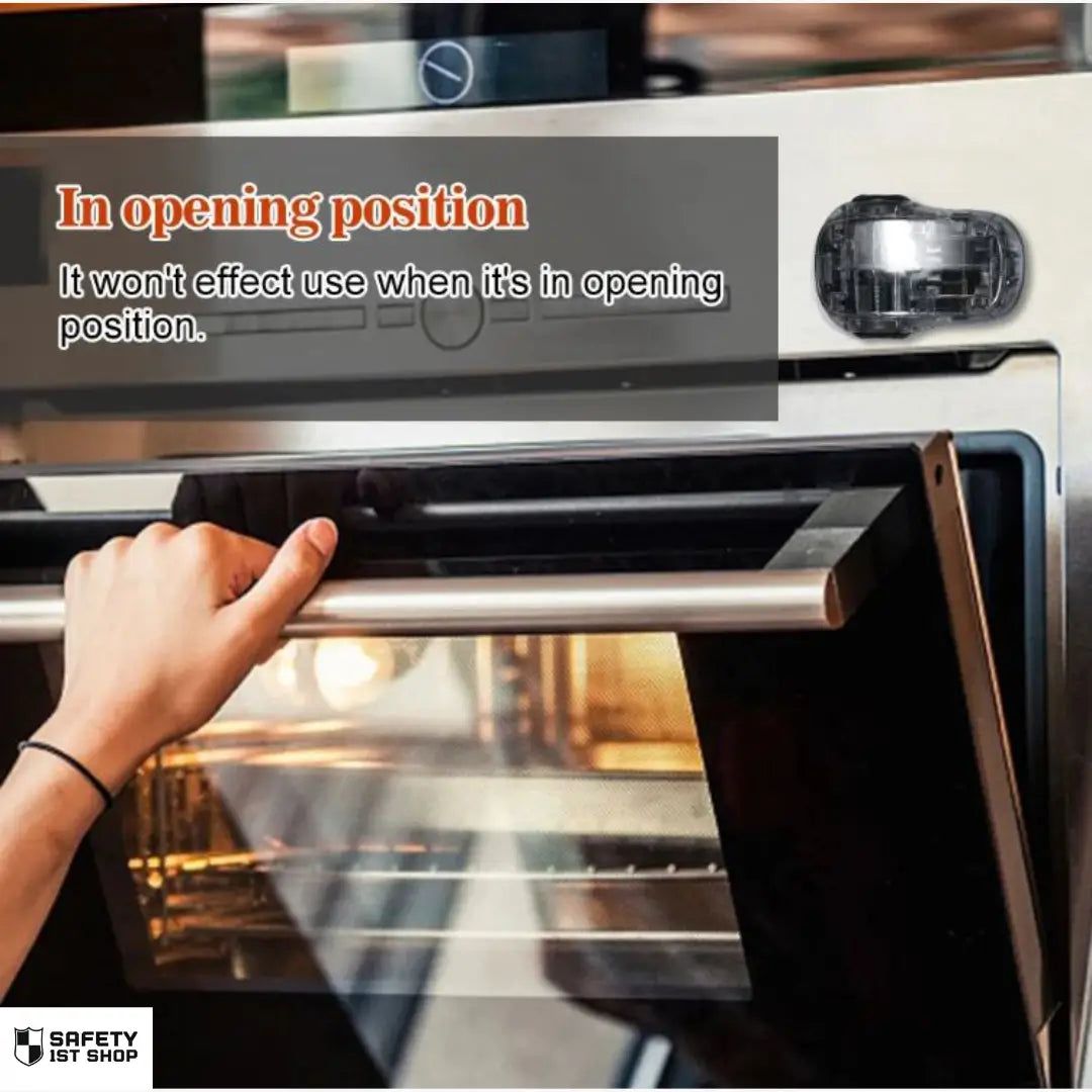 Transparent oven safety lock in open position – adult hand opening white oven effortlessly while lock remains mounted