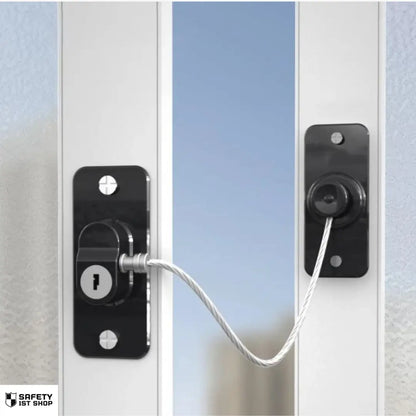 Black window safety lock with key mechanism, mounted to restrict full opening and prevent unauthorized acces