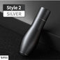 Matte silver emergency car hammer standing vertically on black surface – sleek and refined alternative design